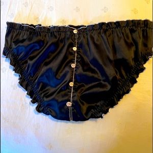 Sexy satiny black panties with sweet details.